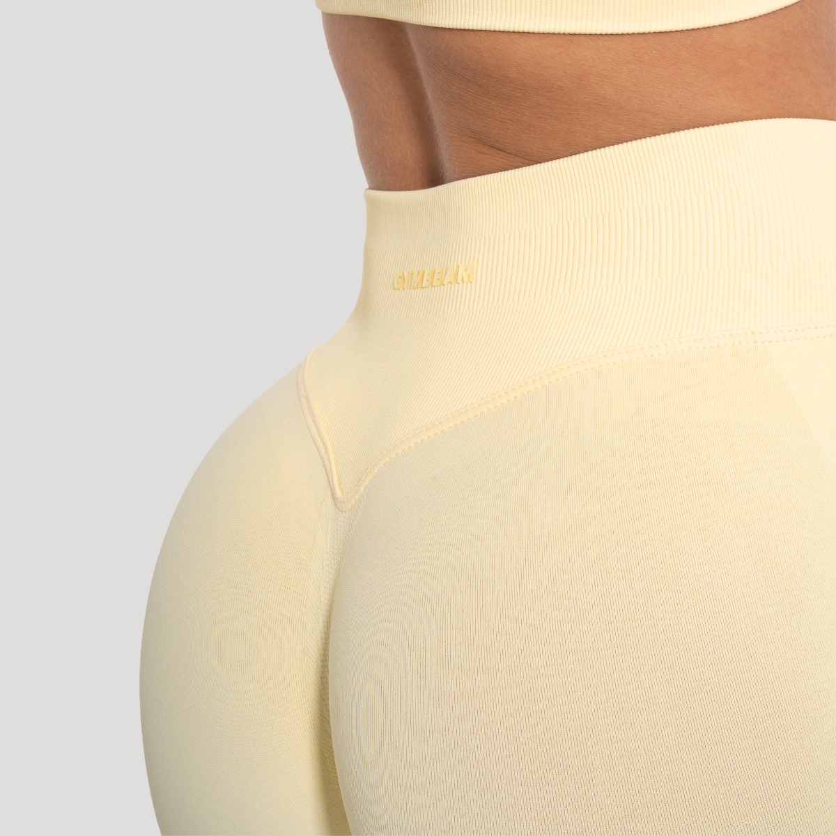 GymBeam Ženske tajice Luma Butter Yellow - Veličina: XS | Boja: Žuta | Težina: 0,215 g | Pakiranje: 85 · záber 6